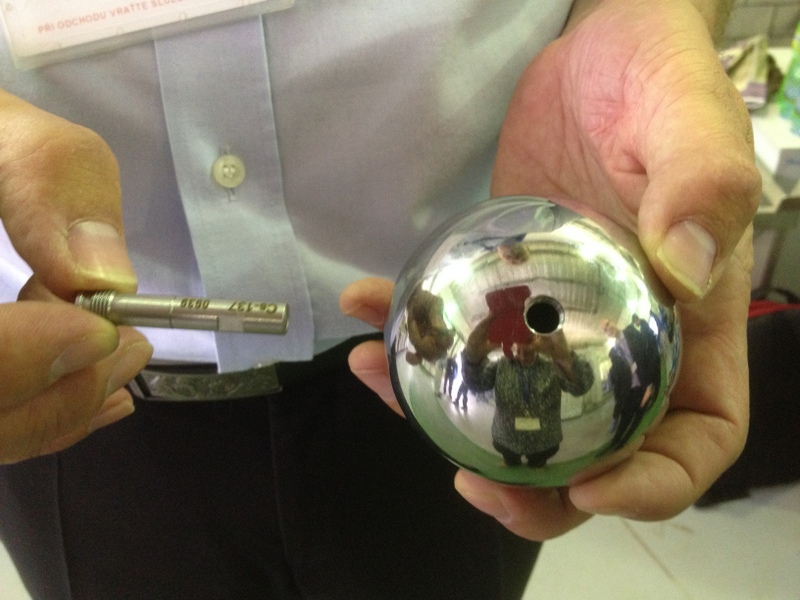 A colleague showing a very low level sample of known activity coudl be place inside a hollow steel ball,simulating radiation trapped inside steel pipes.